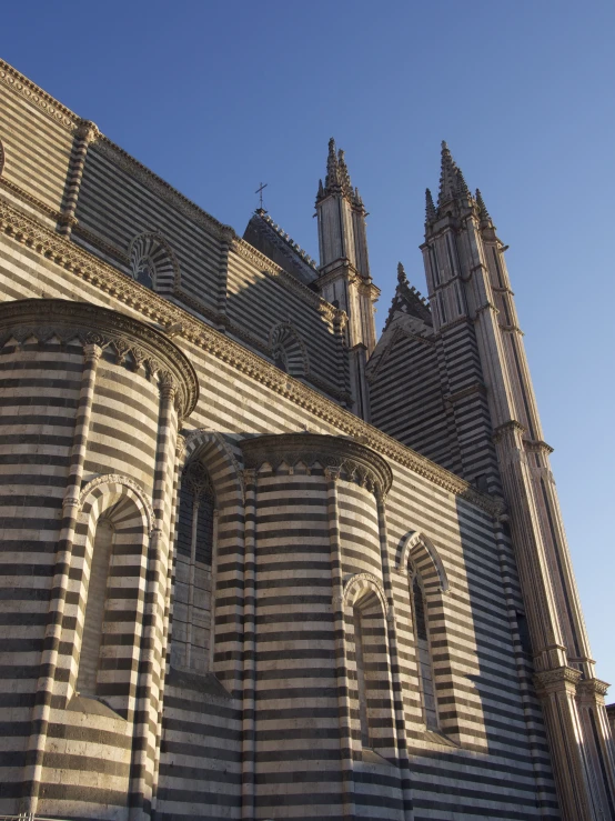 a tall, striped building with an architecturally ornate design