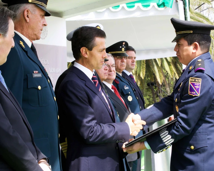 a group of people standing around in uniform