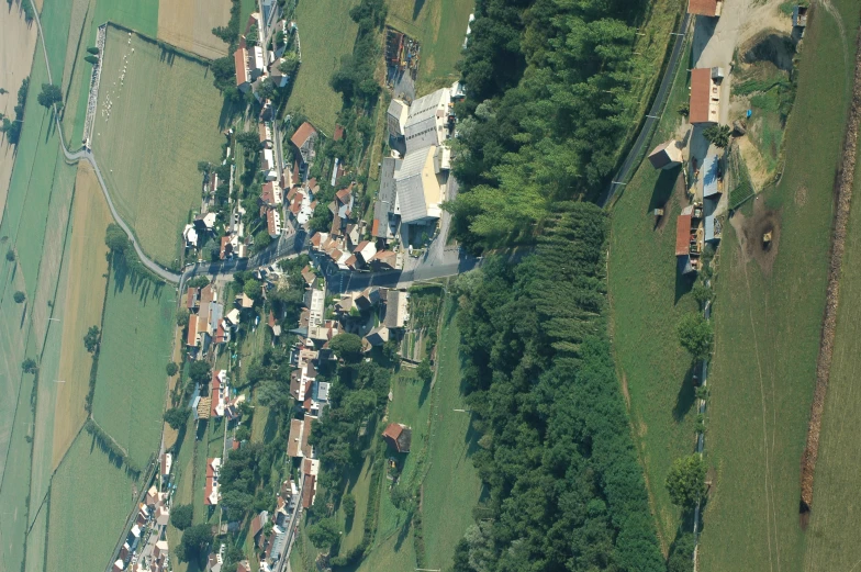 an aerial view shows houses and a road
