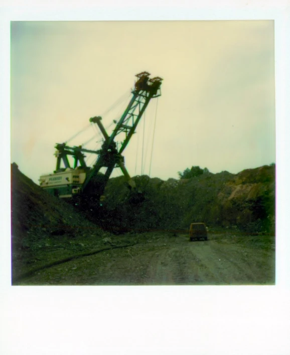 an overcast day and a small truck near some rocks