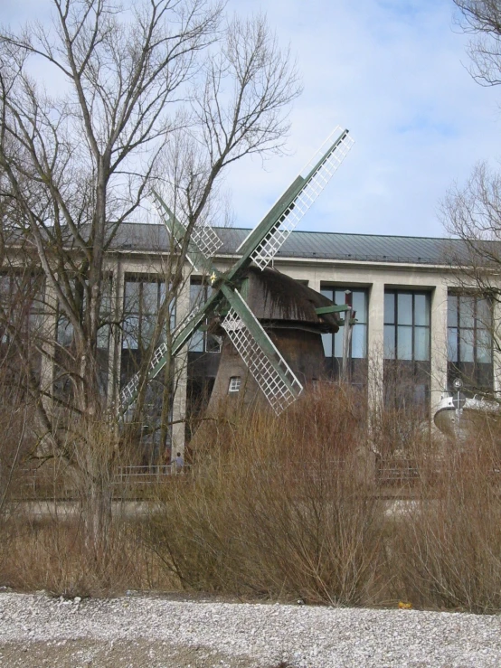 a windmill that has been partially lifted by some kind of pole