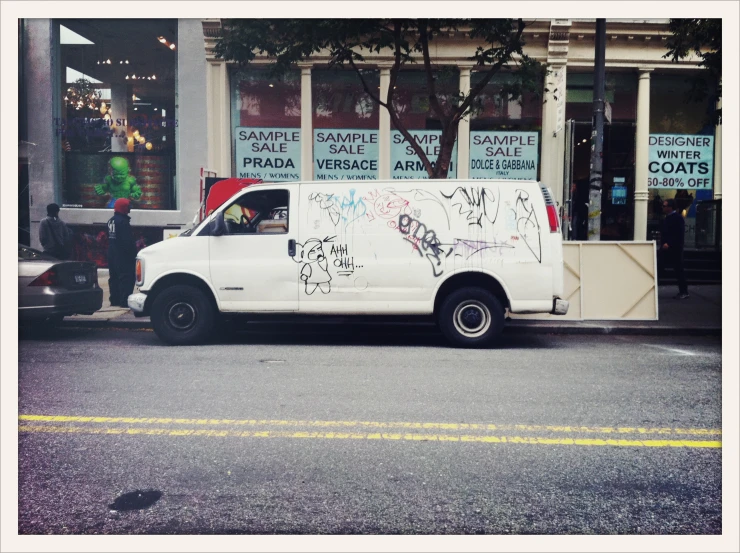 a white van parked on the side of a road