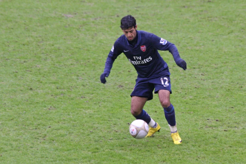 a man with a soccer ball on the field