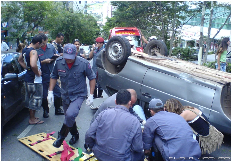 some people standing around a truck and the back of it