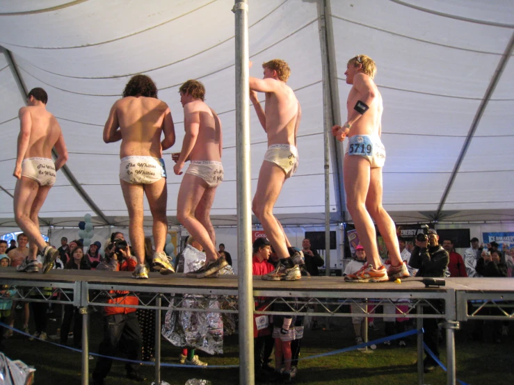 a couple of men standing on a ramp in shorts