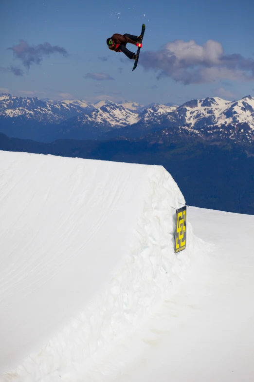 a man flying through the air while riding skis