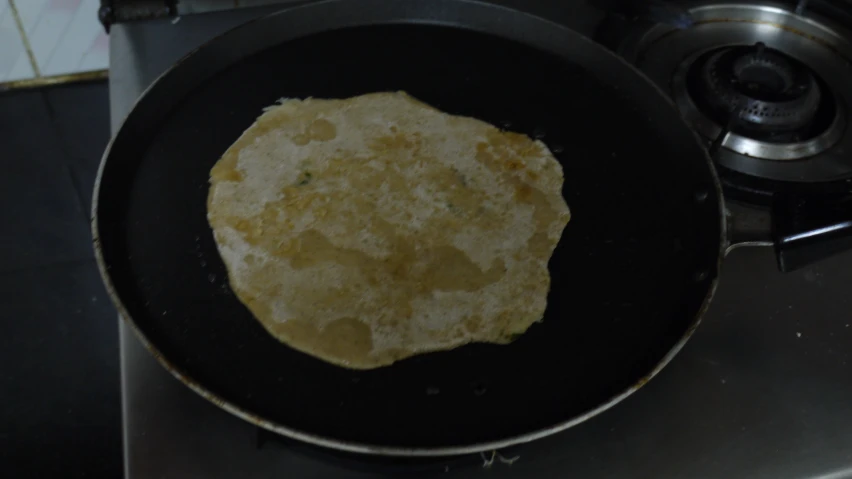 an omelette sits in a pan on the stove top