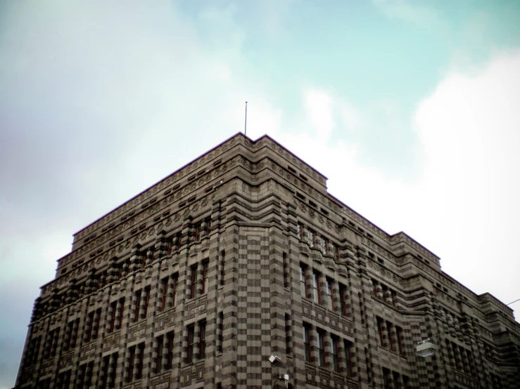 view of a building looking up into the sky