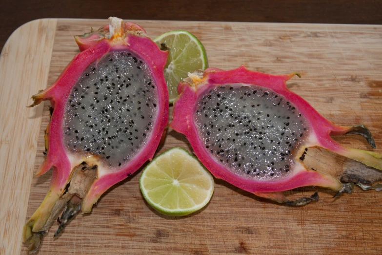 a green lime and a black dragon fruit