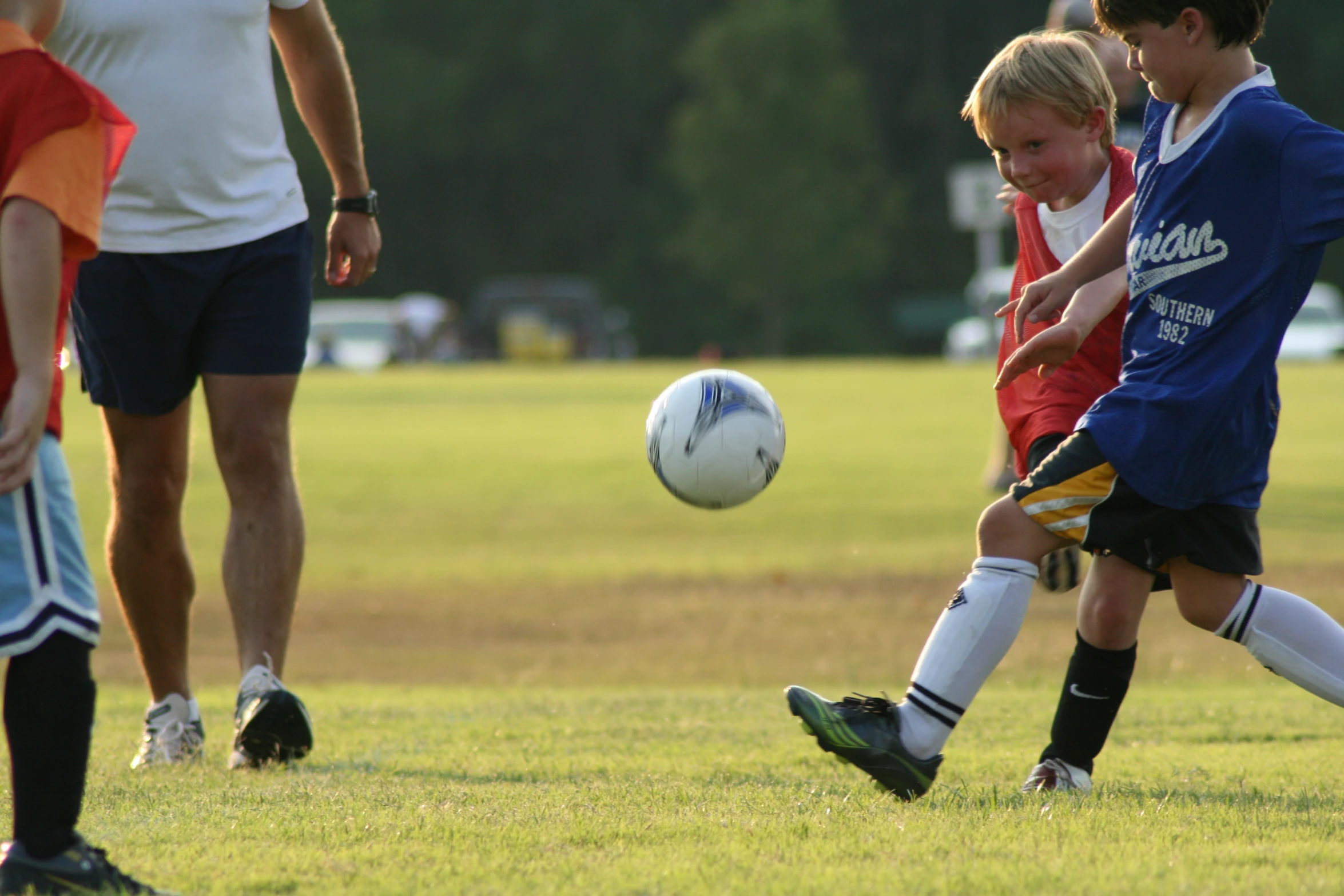 a group of boys playing a game of soccer