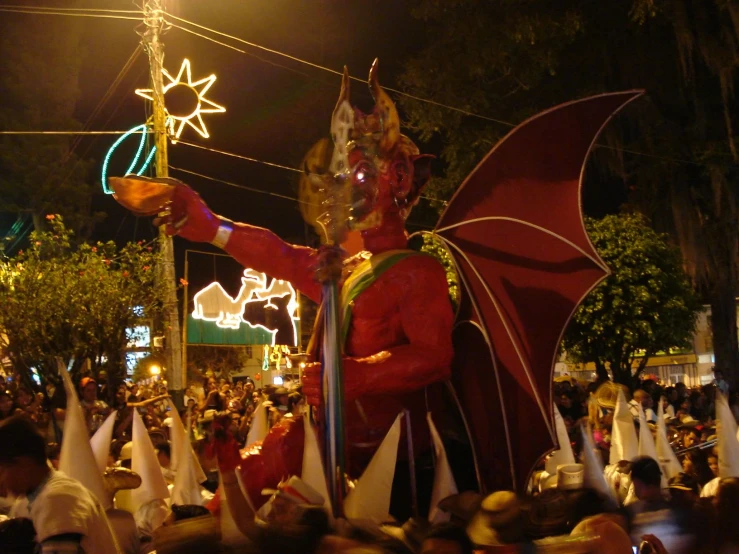 a large statue that is wearing a red costume