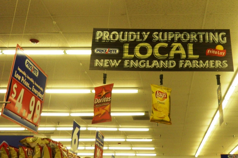 signs for local local new england farmers and their products in a store