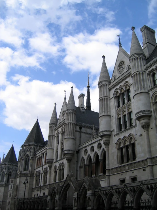 the tall building is surrounded by many spires