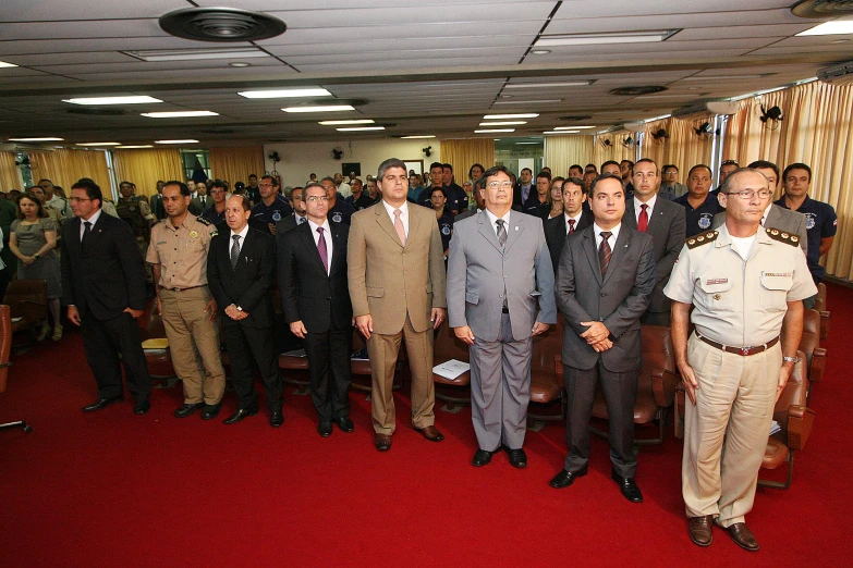 group of men in suits standing together for pograph