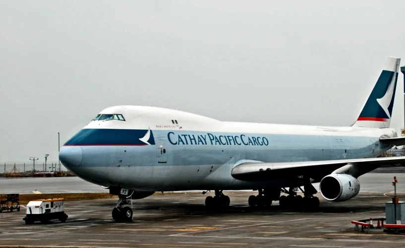 a large white airplane parked on an airport tarmac