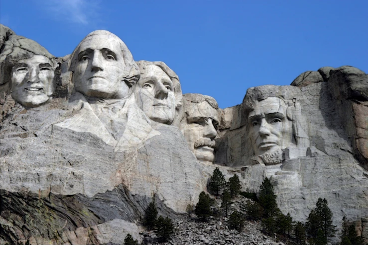 many presidents carved into a mountain on top of rocks