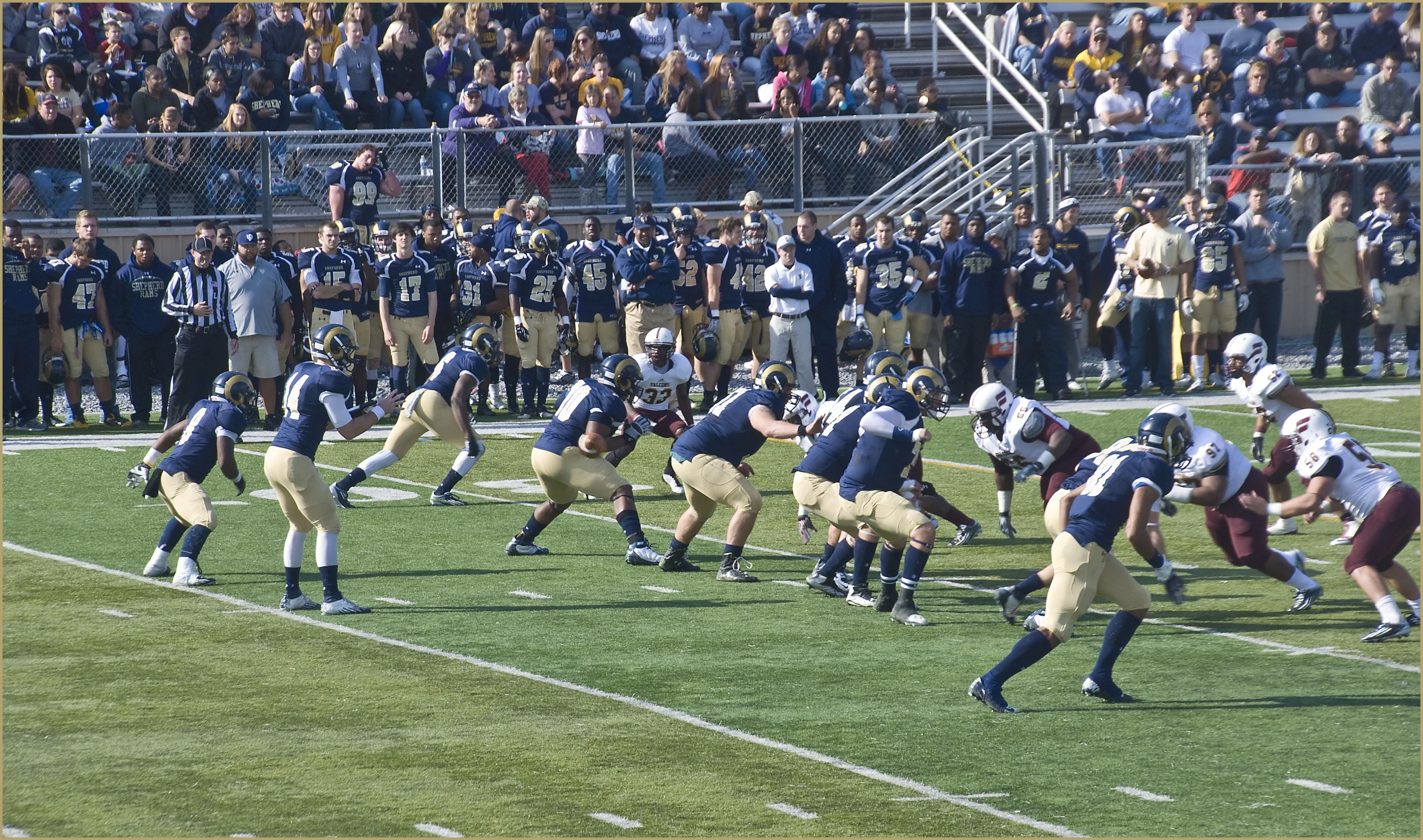 the teams are playing football on the field