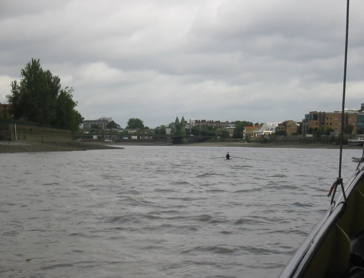 the person riding a boat is in the water