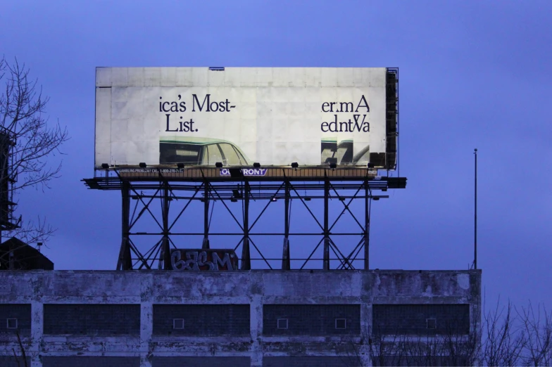 an empty billboard is displayed on top of the building