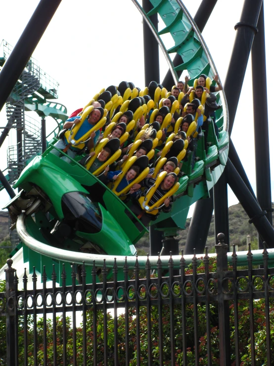 a roller coaster in an amut park filled with lots of rides