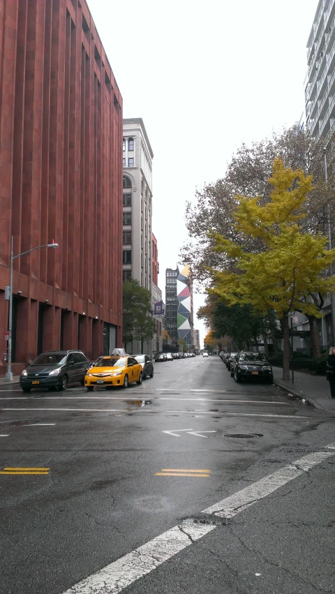 the cars are parked on the side of the street