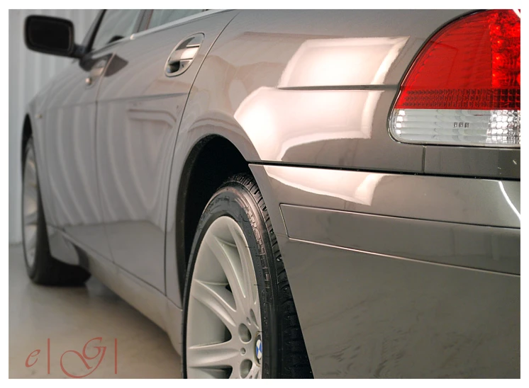 the back end of a silver car is shown