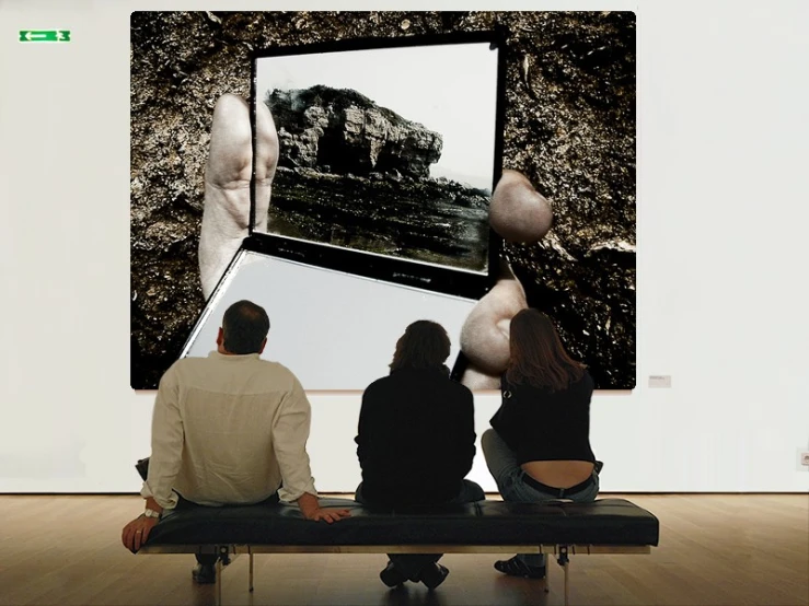three people are sitting on a bench in front of a picture