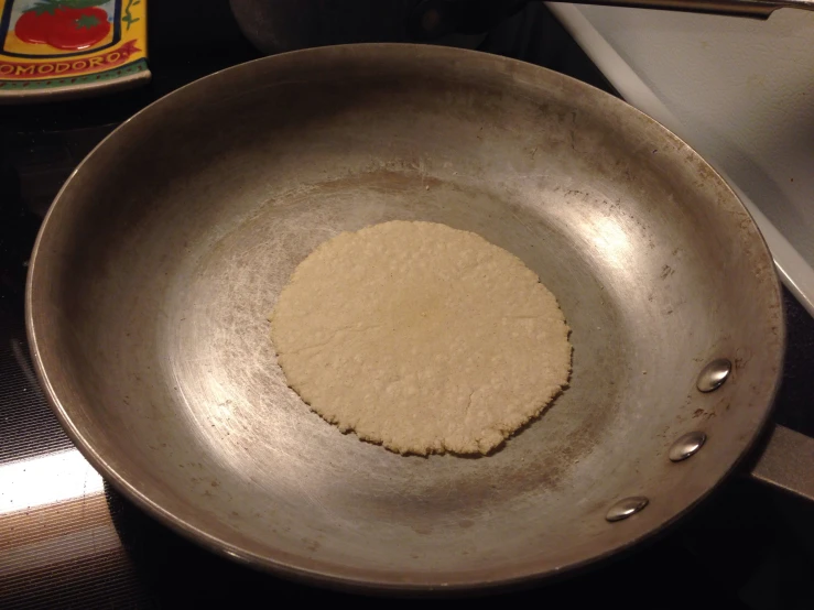 a frying pan with a tiny food item