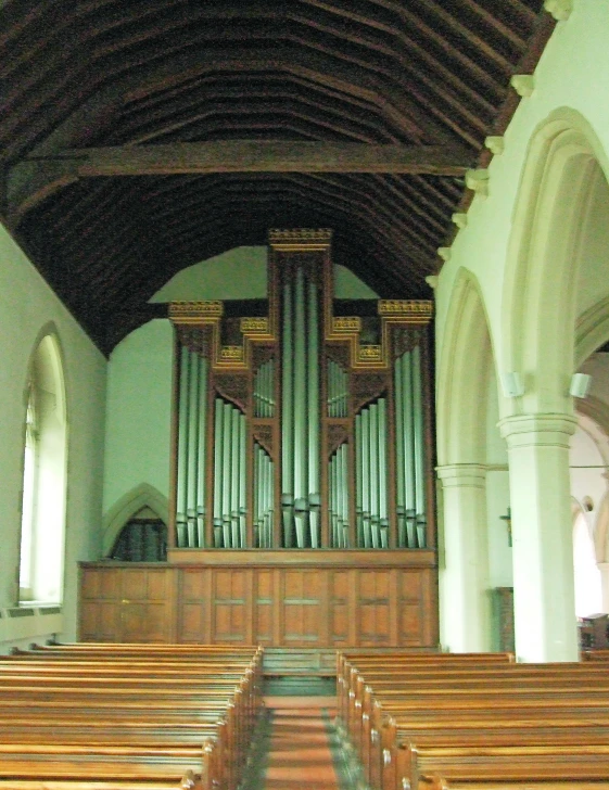 the organ in a church has two wooden benches