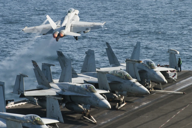 two airplanes and a plane taking off from the landing pad