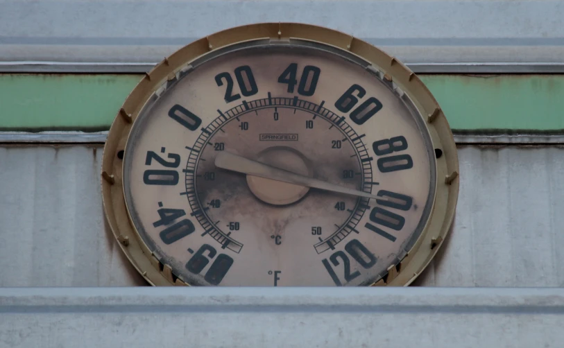 a clock with roman numerals set on a wall