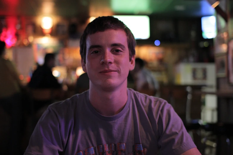 a man sitting at a bar in front of a person