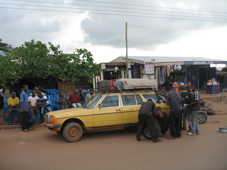 there is a car that is stopped on the side of a street