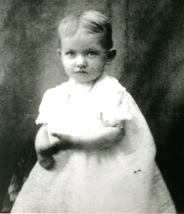 an old po of a little boy dressed in white