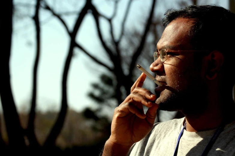 a person smoking a cigarette on his finger