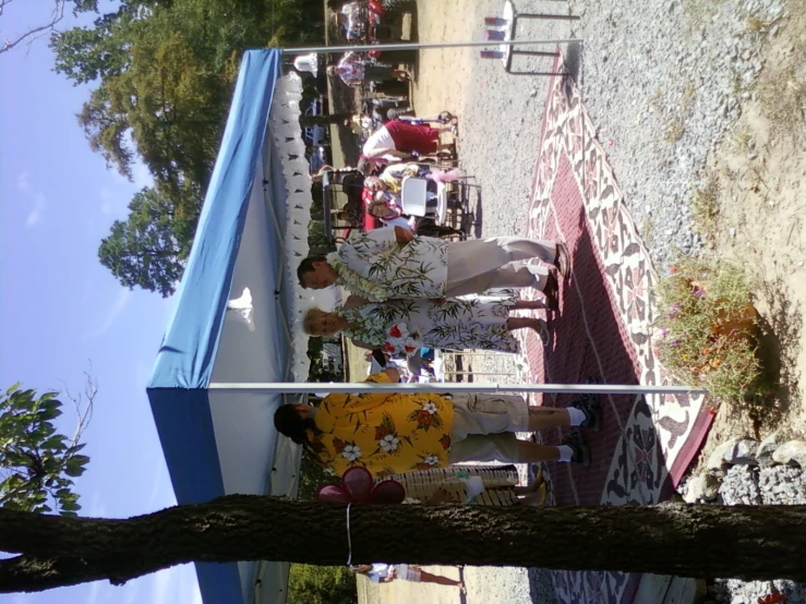 people are in a tent at an outdoor event