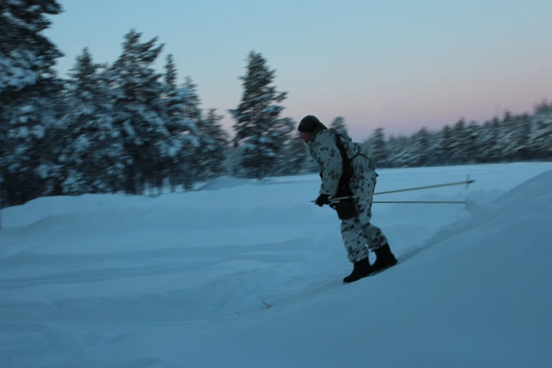 a skier standing still on a snowy slope