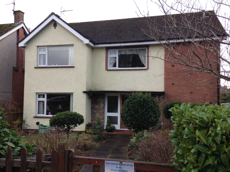 a house has a wooden fence around it