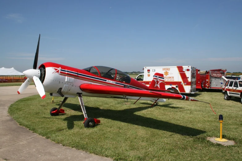 a small engine plane on a grass field