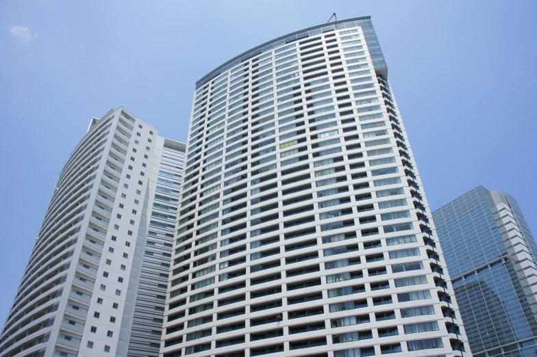 two tall buildings side by side with windows