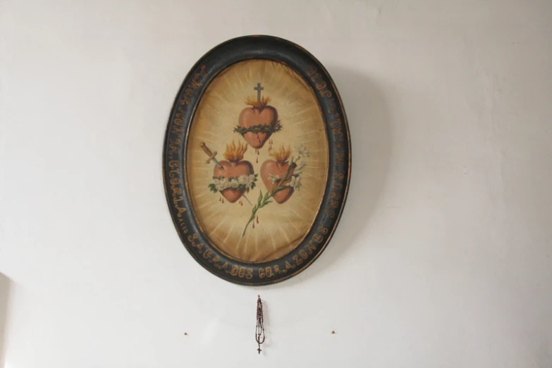 wall hanging with ornate painting in a residential home