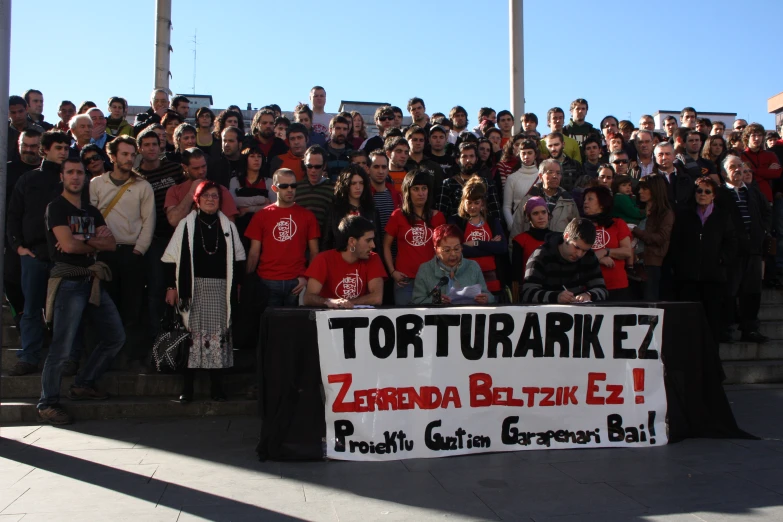 a large group of people stand on some stairs in front of the camera