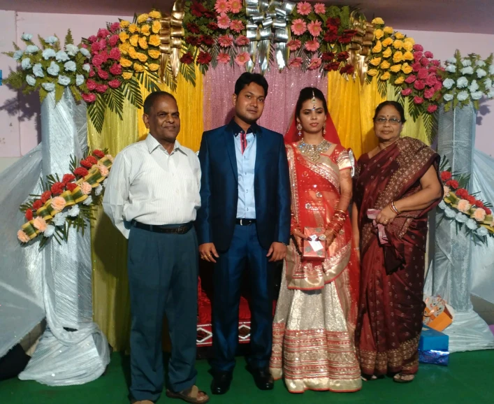 an image of three people and a girl for their wedding