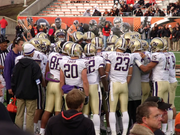 the football team huddled for a huddle before their game