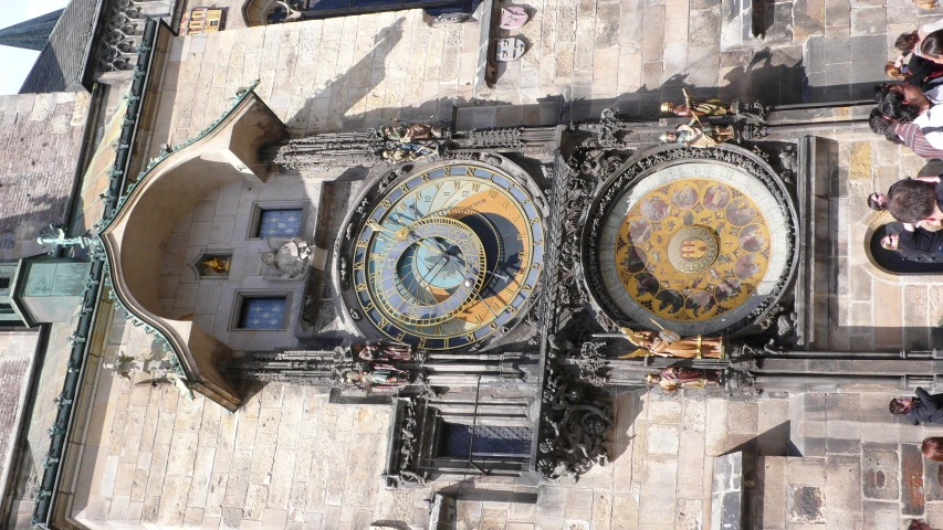 a large clock on the side of a tall building