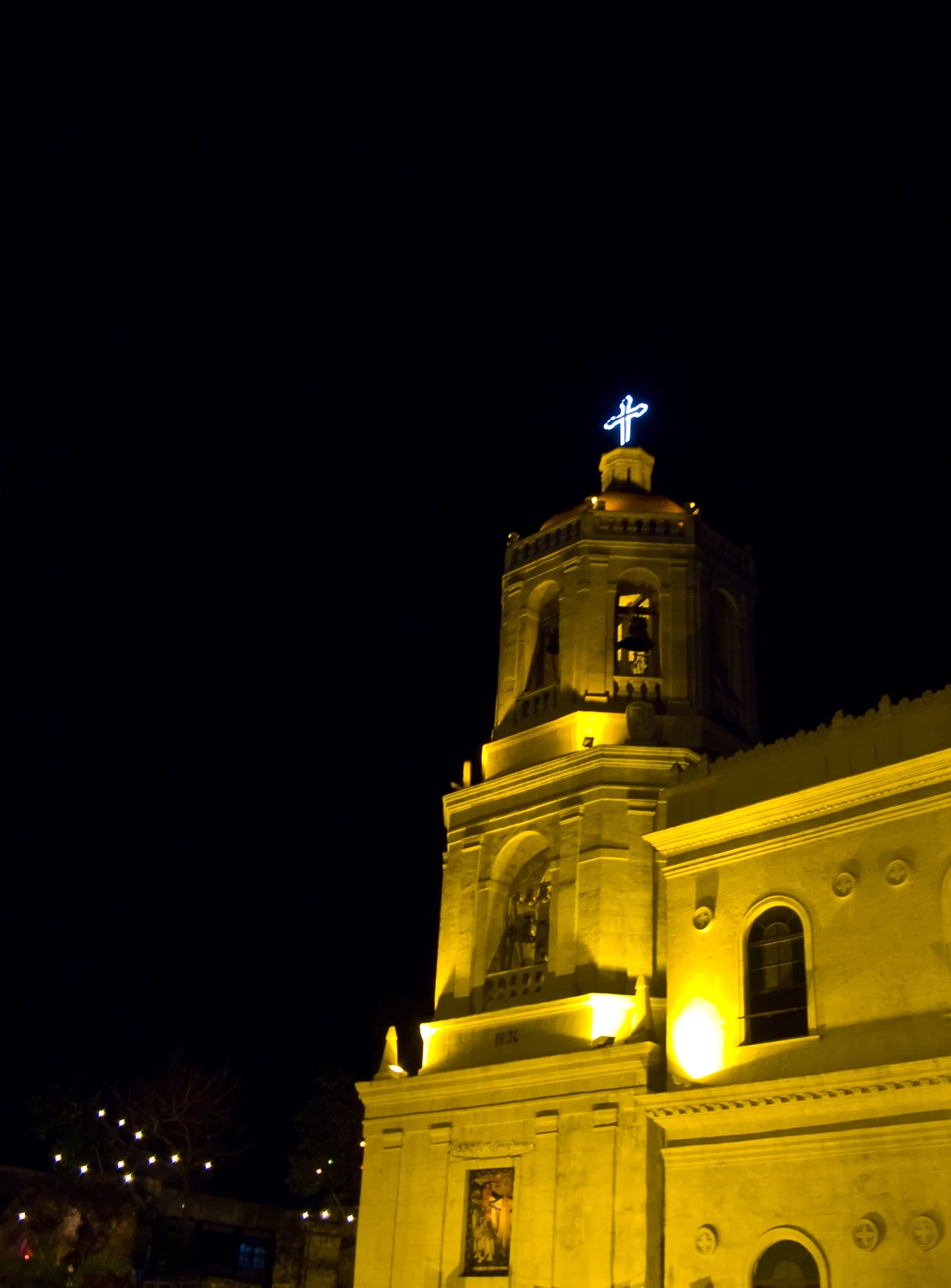 this building is lit up at night with dim lighting