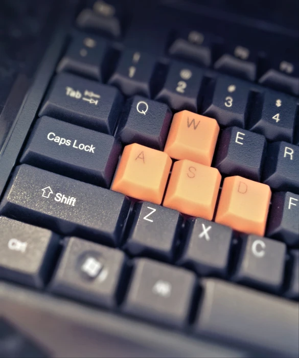 an orange keyboard has small black keys