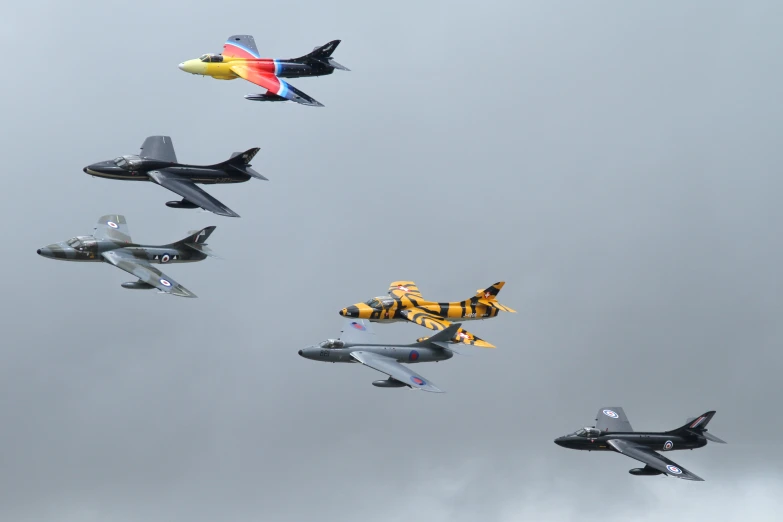 eight jets are flying through the air in formation