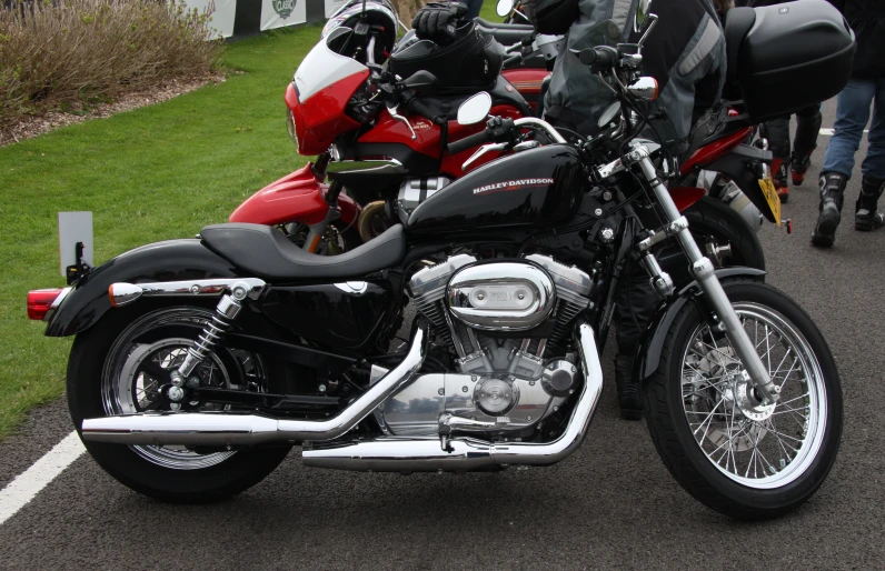 a row of black and red motorcycles lined up against each other