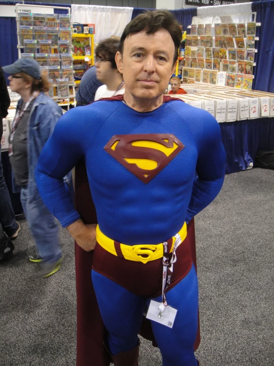 a man dressed up as superman at a convention